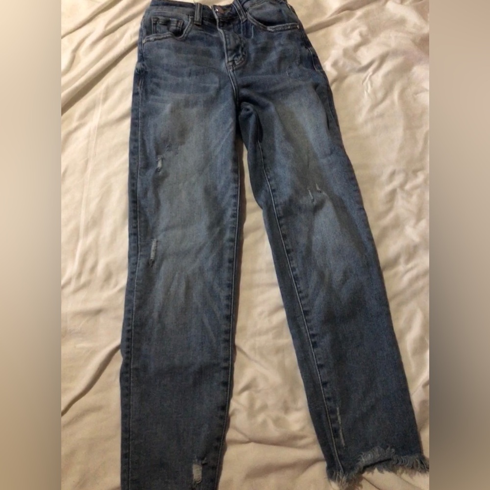 Blue straight legged distressed jeans